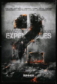 9m273 EXPENDABLES 2 teaser DS 1sh '12 image of tough-guy Sylvester Stallone in blown-up building!