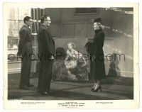 9y406 HISTORY IS MADE AT NIGHT 8x10 still '37 Jean Arthur standing w/ men by her painted portrait
