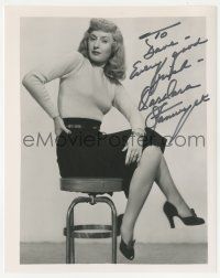 1a665 BARBARA STANWYCK signed 8x10 REPRO still '90 seated with legs crossed from Double Indemnity!