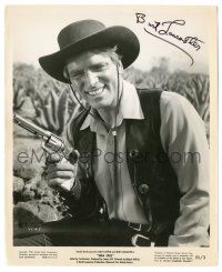 1a387 BURT LANCASTER signed 8.25x10 still '55 great smiling cowboy portrait w/ gun from Vera Cruz!