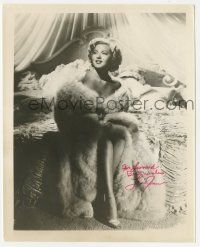 1a806 LANA TURNER signed 8.25x10 REPRO still '80s wonderful seated portrait wearing only fur!