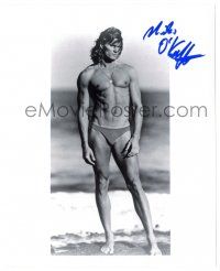 1a846 MILES O'KEEFFE signed 8x10 REPRO still '80s barechested on beach wearing swimsuit!