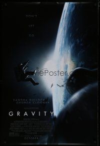 1d340 GRAVITY October advance DS 1sh '13 Sandra Bullock, George Clooney, adrift in space!