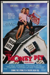 1k492 MONEY PIT advance 1sh '86 Steven Spielberg, Tom Hanks & Shelley Long, deeply in love & debt!