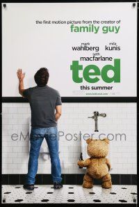 1k749 TED teaser DS 1sh '12 image of Mark Wahlberg & teddy bear at urinals, hilariously wacky!