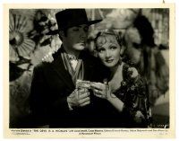 1m267 DEVIL IS A WOMAN 8x10.25 still '35 Marlene Dietrich hands Don Alvarado some money!