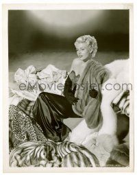 1m768 RITA HAYWORTH 8x10.25 still '47 as sexy blonde in pile of fur coats from Lady from Shanghai!