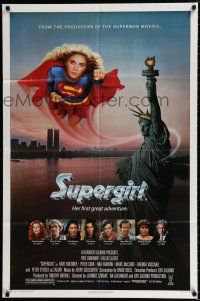 1p837 SUPERGIRL 1sh '84 super Helen Slater in costume flying over Statue of Liberty!