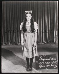 2c114 WIZARD OF OZ 22.75x28.75 still '11 great image of Judy Garland doing wardrobe test!