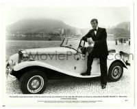 2d656 MOONRAKER 8.25x10.25 still '79 Moore as James Bond by his MP sports car in Rio de Janeiro!