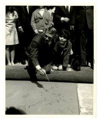 2d858 STEVE McQUEEN 8.25x10 still '67 signing his name in cement at Grauman's Chinese Theater!