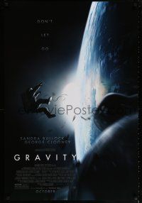 2f339 GRAVITY October advance DS 1sh '13 Sandra Bullock, George Clooney, adrift over earth!