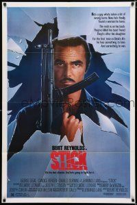 2h846 STICK 1sh '85 cool art of Burt Reynolds w/machine gun, from Elmore Leonard novel!