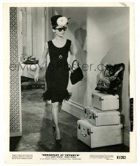 2z156 BREAKFAST AT TIFFANY'S 8.25x10 still '61 Audrey Hepburn full-length walking by luggage!