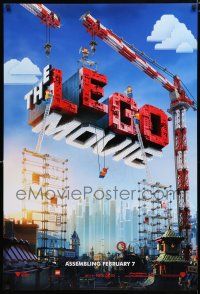 3b441 LEGO MOVIE teaser DS 1sh '14 cool image of title assembled w/cranes & plastic blocks!
