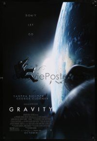 3h307 GRAVITY October style advance DS 1sh '13 Sandra Bullock, George Clooney, adrift over earth!