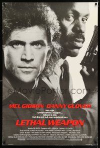 3h440 LETHAL WEAPON advance 1sh '87 great close image of cop partners Mel Gibson & Danny Glover!
