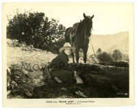 3y129 BLACK ACES 8x10.25 still '37 cowgirl Kay Linaker stashing her loot inside a hollow log!