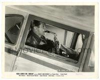 3y401 HERE COMES MR. JORDAN 8x10.25 still '41 c/u of Robert Montgomery playing saxophone in plane!