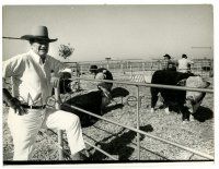 3y509 JOHN WAYNE 8x10 news photo '70s great candid image in cowboy hat posing on ranch by cattle!