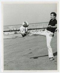 3y571 LIVE & LET DIE candid 8.25x10 still '73 Roger Moore between scenes showing his soccer prowess!