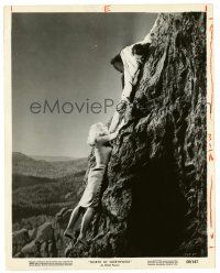 3y689 NORTH BY NORTHWEST 8x10.25 still '59 Cary Grant helps Eva Marie Saint climb up Mt. Rushmore!