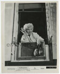 3y811 SEVEN YEAR ITCH 8x10.25 still '55 classic image of Marilyn holding shoes at apartment window!