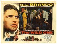 3z982 WILD ONE LC '53 townspeople hold down biker Marlon Brando & get rough with him!