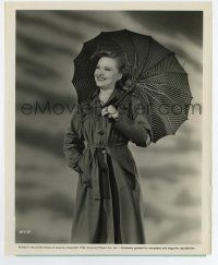 4m804 SUSANNA FOSTER 8.25x10 still '44 c/u smiling in army style trench coat with umbrella!
