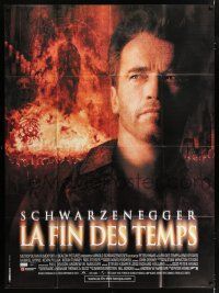 4y623 END OF DAYS French 1p '99 close up of grizzled Arnold Schwarzenegger over fiery background!