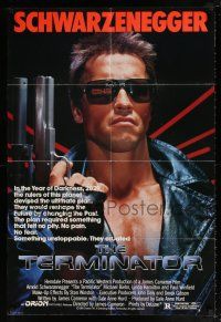 6f860 TERMINATOR 1sh '84 close up of classic cyborg Arnold Schwarzenegger with gun!