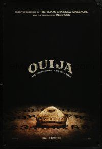7g568 OUIJA teaser DS 1sh '14 cool image of the board, keep telling yourself it's just a game!