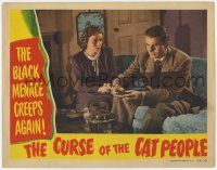 7j159 CURSE OF THE CAT PEOPLE LC '44 Eve March watches Kent Smith put tobacco in his pipe!
