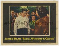 7j033 REBEL WITHOUT A CAUSE LC #1 '55 c/u of James Dean, who doesn't fit in at his new school!