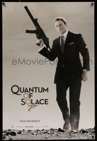 7r578 QUANTUM OF SOLACE teaser 1sh '08 Daniel Craig as Bond with silenced H&K UMP submachine gun