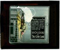 8b004 GRIM GAME glass slide '19 classic image of straitjacketed Harry Houdini hanging off building!