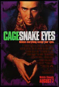8k685 SNAKE EYES advance DS 1sh '98 close-up of Nicolas Cage, believe everything except your eyes!
