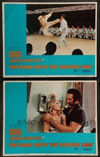 8z958 MAN WITH THE GOLDEN GUN 2 LCs '74 Moore as James Bond getting karate kicked + Maud Adams