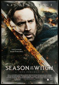 9j460 SEASON OF THE WITCH DS bus stop '11 close image of Nicolas Cage & flaming sword!