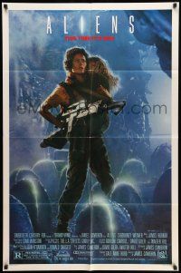 9p036 ALIENS 1sh '86 James Cameron, Sigourney Weaver as Ripley holding Carrie Henn!