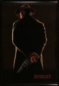 9w802 UNFORGIVEN teaser 1sh '92 image of gunslinger Clint Eastwood w/back turned, undated design!