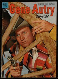 1a382 GENE AUTRY COMICS comic book January 1953 close up of Gene with pistol drawn by wagon wheel!