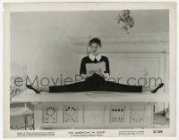 1m111 AMERICAN IN PARIS 8x10.25 still '51 Leslie Caron does the splits while reading a book!