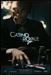 2c146 CASINO ROYALE teaser DS 1sh '06 Craig as James Bond sitting at poker table w/gun!