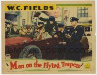 2f787 MAN ON THE FLYING TRAPEZE LC '35 crowd watches policemen giving ticket to W.C. Fields!
