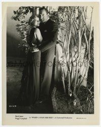 2s967 WHEN A MAN SEES RED 8x10.25 still '34 full-length c/u of Buck Jones in suit w/Peggy Campbell