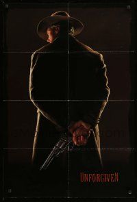 2t944 UNFORGIVEN teaser 1sh '92 image of gunslinger Clint Eastwood w/back turned, undated design!