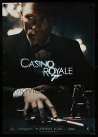 3b119 CASINO ROYALE teaser DS German '06 Daniel Craig as James Bond sitting at poker table w/gun!