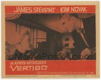 3k016 VERTIGO LC #8 '58 Alfred Hitchcock, standing James Stewart glares at blonde Kim Novak!