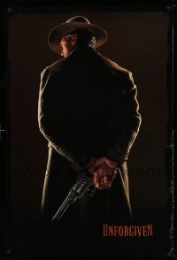 3s876 UNFORGIVEN teaser 1sh '92 image of gunslinger Clint Eastwood w/back turned, undated design!